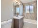 Bathroom with a modern vanity, stylish mirror, and a shower-tub combination at 382 S Decatur St, Denver, CO 80219