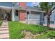 Exterior view of the home showing the grass and landscaping at 262 S Nome St, Aurora, CO 80012