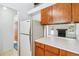 Cozy kitchen featuring wood cabinets and a view into a living room with a fireplace at 262 S Nome St, Aurora, CO 80012