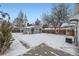 Detached garage and snowy backyard with a walkway at 2354 S Ogden St, Denver, CO 80210