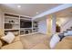 Finished basement with two couches and built-in shelving at 2354 S Ogden St, Denver, CO 80210