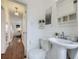 Simple bathroom with pedestal sink and toilet at 2354 S Ogden St, Denver, CO 80210