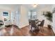 Dining area with hardwood floors and a glass-top dining table at 2354 S Ogden St, Denver, CO 80210