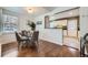 Bright dining area with hardwood floors and kitchen view at 2354 S Ogden St, Denver, CO 80210