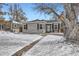 Gray house with black shutters, snowy front yard, and walkway at 2354 S Ogden St, Denver, CO 80210