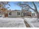 Gray house with black shutters, snowy front yard, and walkway at 2354 S Ogden St, Denver, CO 80210