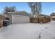 Detached gray garage with an attached alleyway at 2354 S Ogden St, Denver, CO 80210