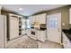 Kitchen with white cabinets, granite counters, and gas range at 2354 S Ogden St, Denver, CO 80210