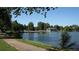 Scenic view of a lake with a boathouse and walking path at 2354 S Ogden St, Denver, CO 80210