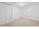 Carpeted basement area with a large closet and a small window at 6193 Holland St, Arvada, CO 80004