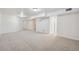 Large finished basement area with recessed lighting and multiple doorways at 6193 Holland St, Arvada, CO 80004