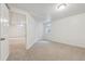 Cozy bedroom featuring neutral carpet, white walls, trim and door, and a small window at 6193 Holland St, Arvada, CO 80004