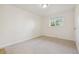Clean, carpeted bedroom with a window providing natural light at 6193 Holland St, Arvada, CO 80004