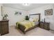 Cozy bedroom featuring carpet floors, a stylish bed frame, and complementary bedside furniture with decor at 6193 Holland St, Arvada, CO 80004