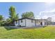 Charming single story home featuring a well maintained lawn and covered car port at 6193 Holland St, Arvada, CO 80004