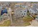 An elevated aerial view of the back of the property with a back deck and a well-maintained yard surrounded by a wood fence at 13472 Monroe St, Thornton, CO 80241