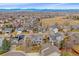 An aerial view of the property, showcasing the home's location in a beautiful neighborhood with views of mountains in the distance at 13472 Monroe St, Thornton, CO 80241