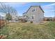 Wide view of the fenced backyard with a deck and access to the house, offering a private and serene outdoor space at 13472 Monroe St, Thornton, CO 80241