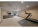 Spacious finished basement with a fireplace, comfortable seating, and exercise equipment at 13472 Monroe St, Thornton, CO 80241