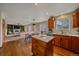 Bright kitchen featuring wood cabinets, stainless steel appliances, and a center island with marble countertop at 13472 Monroe St, Thornton, CO 80241