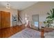 Inviting living room boasts hardwood floors, a stylish rug, and a staircase, creating a welcoming ambiance at 13472 Monroe St, Thornton, CO 80241