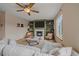 The living room features a modern fireplace, built-in shelving, neutral carpeting, and a lighted ceiling fan at 13472 Monroe St, Thornton, CO 80241