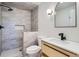 Modern bathroom featuring a stand-up shower, updated vanity, and sleek tile work at 851 S Umatilla Way, Denver, CO 80223