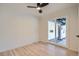 Bedroom with sliding glass door and hardwood floors, creating a warm, inviting space at 851 S Umatilla Way, Denver, CO 80223