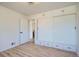 Bedroom with built-in storage and hardwood floors for a functional and stylish design at 851 S Umatilla Way, Denver, CO 80223