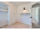 Bedroom featuring hardwood floors, bright walls, built-in storage, and updated windows at 851 S Umatilla Way, Denver, CO 80223