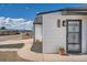 View of the home's front entrance with decorative security door at 851 S Umatilla Way, Denver, CO 80223