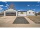 Cozy home with garage and welcoming landscaping and hardscape at 851 S Umatilla Way, Denver, CO 80223