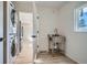 Bright laundry area with modern washer and dryer and stainless steel sink in view at 851 S Umatilla Way, Denver, CO 80223