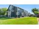 Large, grassy backyard with a patio, grill, and full home exterior at 11545 E 119Th Ave, Commerce City, CO 80640