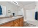 Standard bathroom featuring a single sink vanity and shower-tub combo at 11545 E 119Th Ave, Commerce City, CO 80640