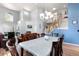 Well-lit dining area with hardwood floors and easy access to living room and staircase at 11545 E 119Th Ave, Commerce City, CO 80640
