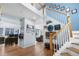 Two-story foyer with wood floors, staircase, and open floorplan at 11545 E 119Th Ave, Commerce City, CO 80640