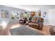 View of the living room and dining area with hardwood floors at 11545 E 119Th Ave, Commerce City, CO 80640
