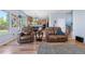 Living room with views of the kitchen and plush leather seating at 11545 E 119Th Ave, Commerce City, CO 80640