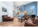 Bright and airy living room with hardwood floors and a staircase leading to the second level at 11545 E 119Th Ave, Commerce City, CO 80640