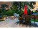 Backyard patio with fire pit and dining area at 2775 E Dartmouth Ave, Denver, CO 80210