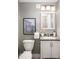 Basement bathroom with updated vanity and fixtures at 2775 E Dartmouth Ave, Denver, CO 80210