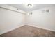 Simple basement bedroom with carpeted floor at 2775 E Dartmouth Ave, Denver, CO 80210