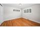 Bright bedroom with hardwood floors and window shutters at 2775 E Dartmouth Ave, Denver, CO 80210