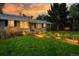 House exterior at sunset with manicured lawn at 2775 E Dartmouth Ave, Denver, CO 80210