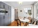 Kitchen features gray cabinets, microwave, and eat-in area at 2775 E Dartmouth Ave, Denver, CO 80210