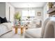 Open living room with white couch and unique coffee table at 2775 E Dartmouth Ave, Denver, CO 80210