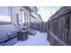 Small backyard with snow, steps, and wooden fence at 2245 E 103Rd Pl, Thornton, CO 80229