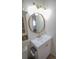 Clean bathroom with white vanity and large mirror at 2245 E 103Rd Pl, Thornton, CO 80229