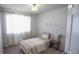 Charming bedroom with a white metal bed frame and window at 2245 E 103Rd Pl, Thornton, CO 80229